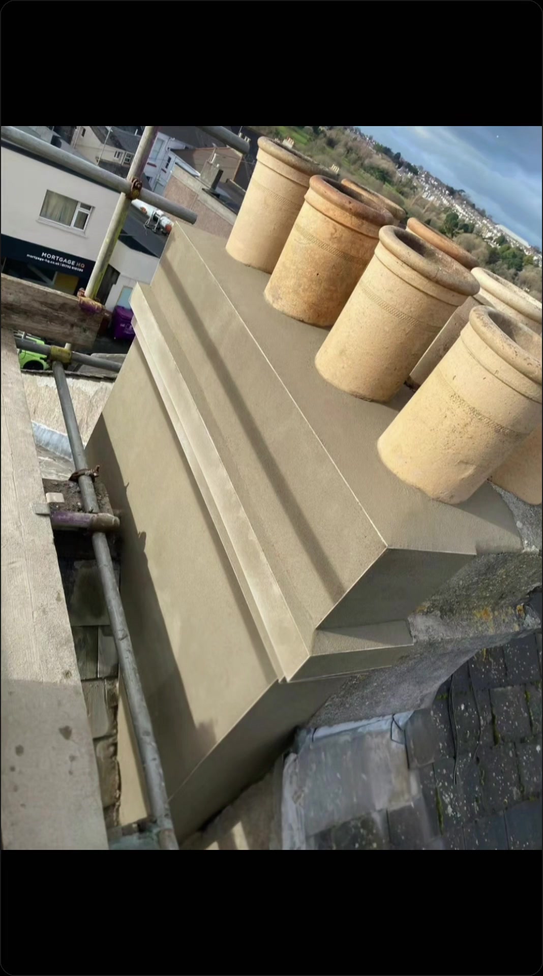 AKM chimney rendering, flaunching and pots on a completed project